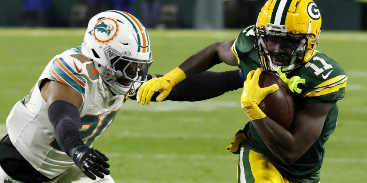 Love completa 2 pases de anotación con Reed y Packers doblegan 30-17 a Dolphins