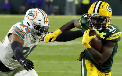 Love completa 2 pases de anotación con Reed y Packers doblegan 30-17 a Dolphins
